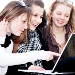 Three teenage girls with laptop
